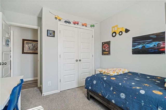 carpeted bedroom with a closet