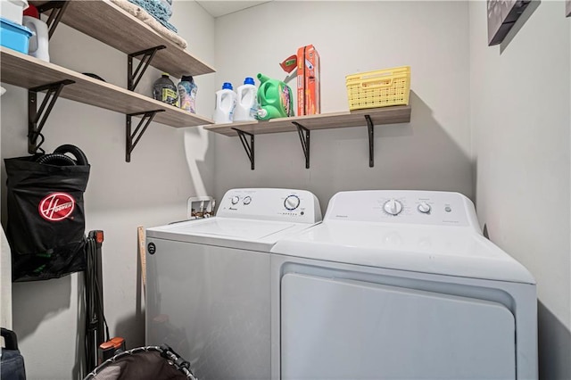 clothes washing area with independent washer and dryer