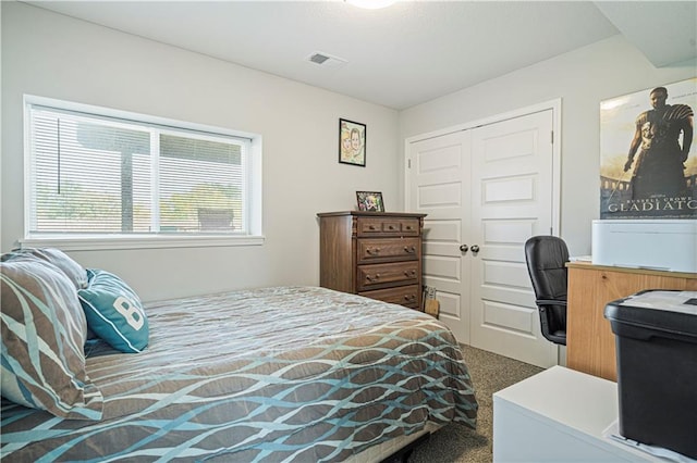 carpeted bedroom featuring a closet