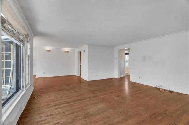 spare room with wood finished floors