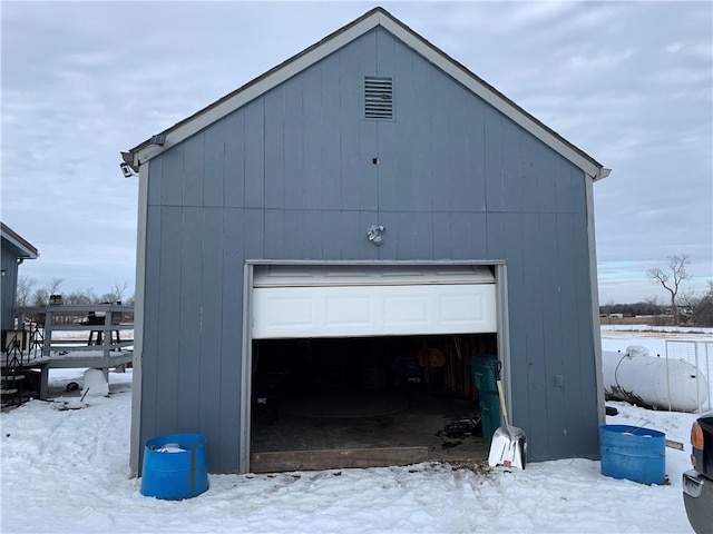 view of snow covered garage