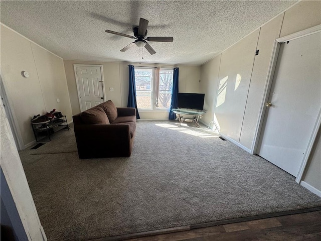 unfurnished living room with a textured ceiling, carpet floors, and a ceiling fan