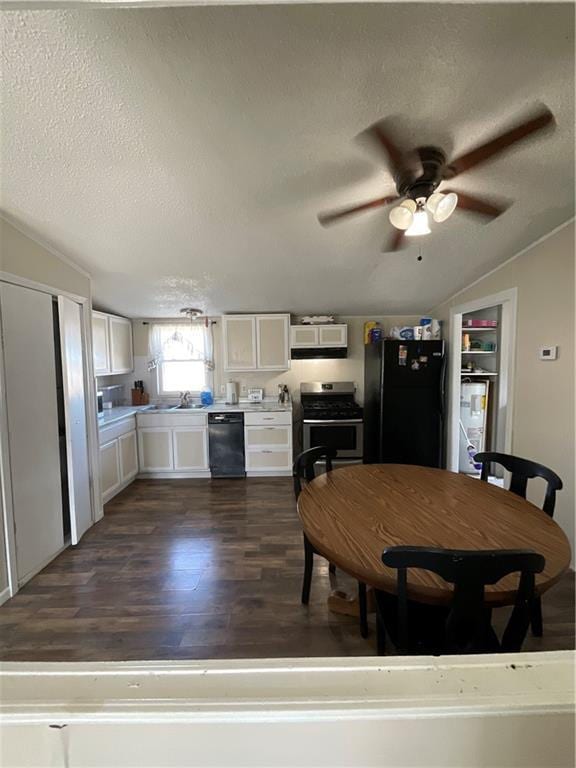 kitchen featuring dark wood-type flooring, white cabinets, a textured ceiling, and black appliances