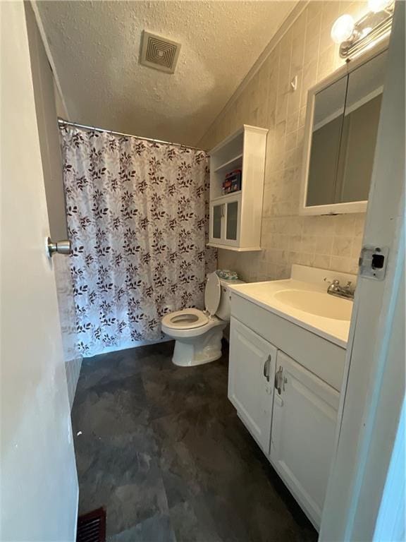 bathroom featuring curtained shower, visible vents, toilet, a textured ceiling, and vanity