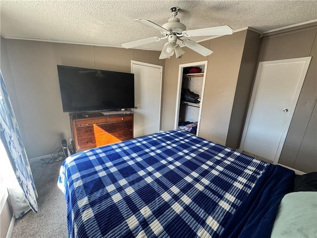 bedroom featuring carpet floors, a closet, ceiling fan, and a textured ceiling