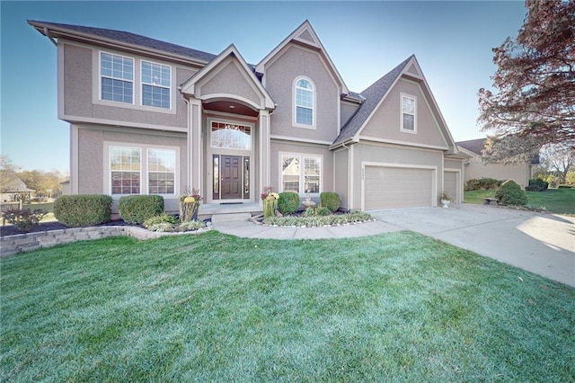 view of front of home with a garage and a front yard