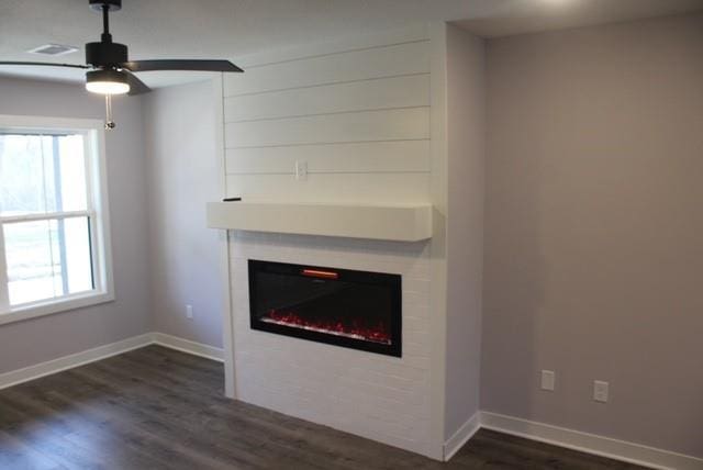 interior details featuring wood-type flooring and ceiling fan