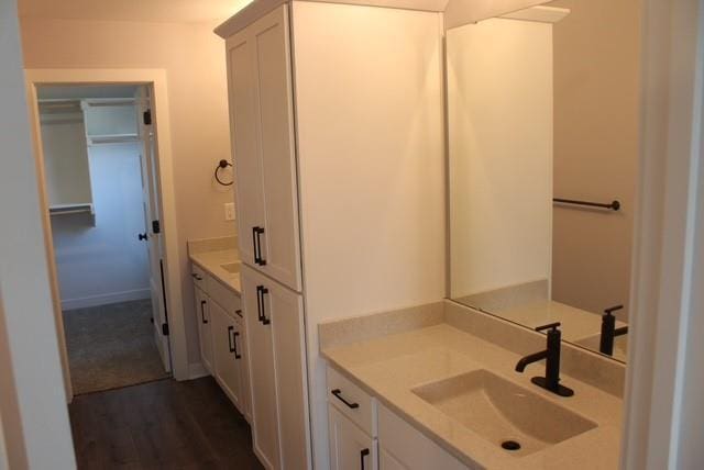 bathroom with vanity and hardwood / wood-style flooring