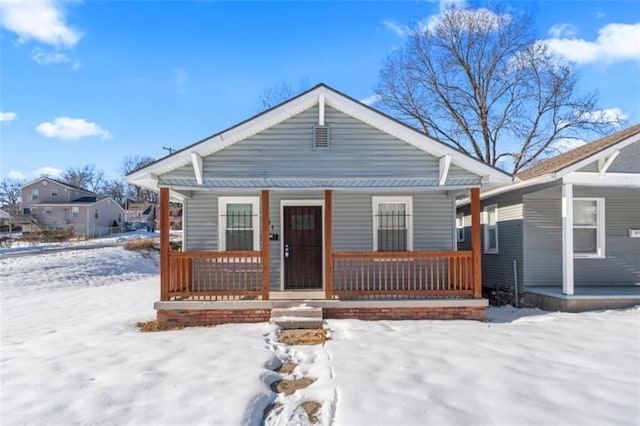 bungalow-style house featuring covered porch