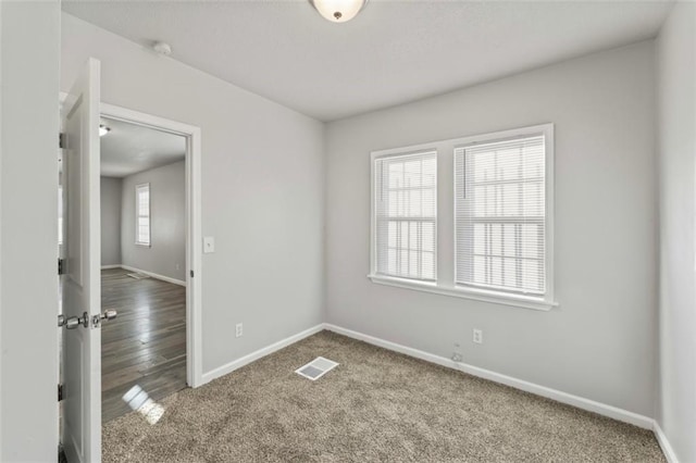 unfurnished room with carpet flooring