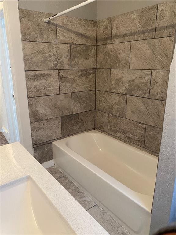 bathroom featuring vanity and shower / bath combination