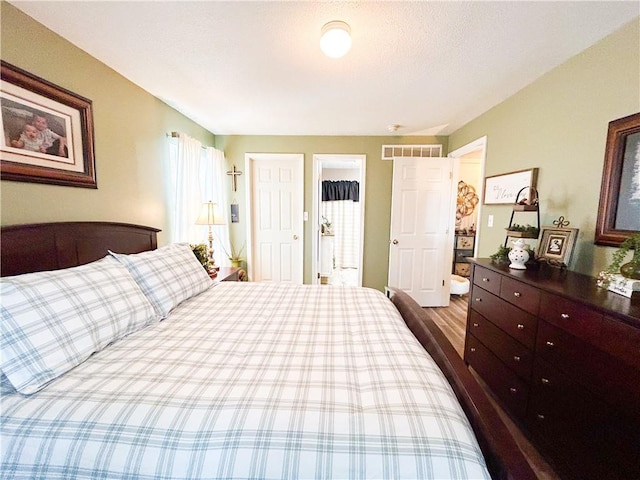 bedroom with hardwood / wood-style floors