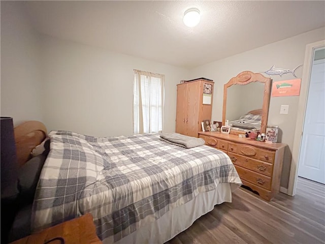 bedroom featuring wood-type flooring