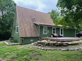 17 Lakewood Ln, Linn Valley, KS 66040 - rear view of property with a deck and a lawn