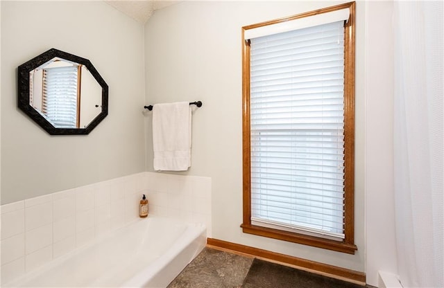 bathroom featuring a washtub