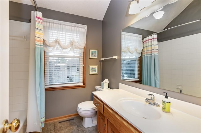 full bathroom featuring vanity, toilet, and shower / tub combo