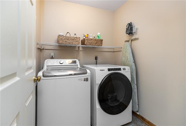 washroom featuring washing machine and clothes dryer