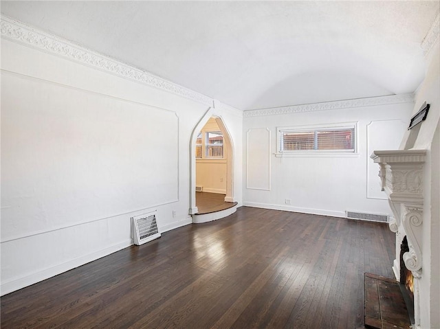 unfurnished living room with dark wood-type flooring and lofted ceiling