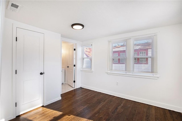 unfurnished bedroom featuring hardwood / wood-style floors