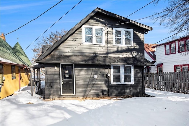 view of snow covered house