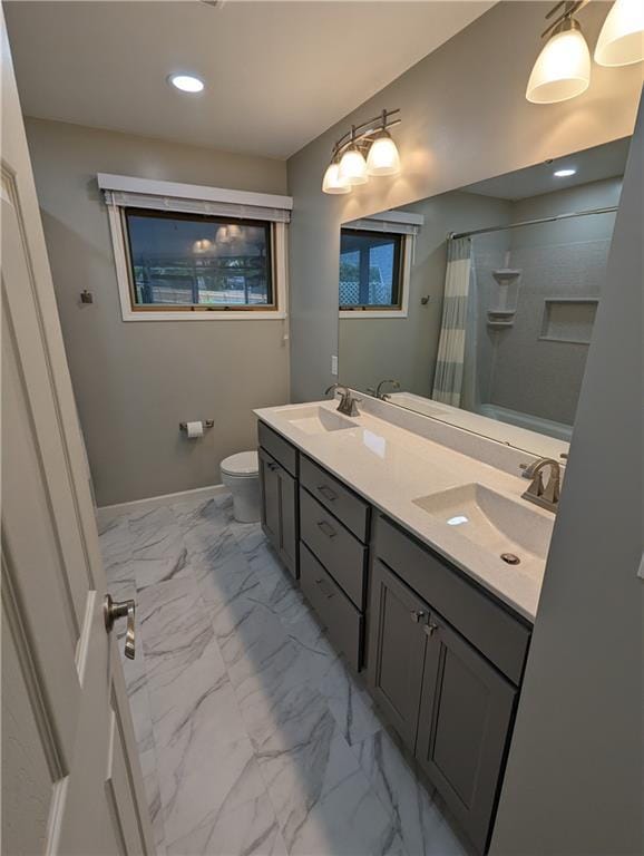 bathroom with a shower with curtain, vanity, and toilet