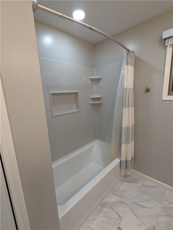 bathroom featuring shower / bath combo with shower curtain