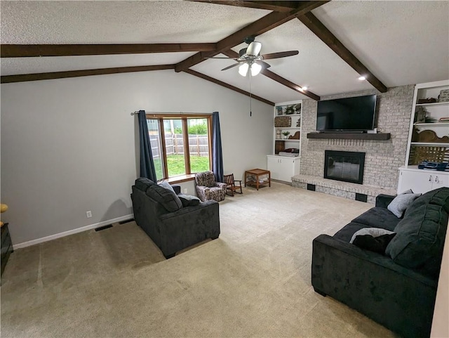 carpeted living room featuring built in shelves, a textured ceiling, lofted ceiling with beams, and a brick fireplace