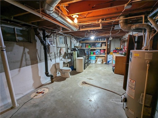 basement featuring washer / clothes dryer and water heater