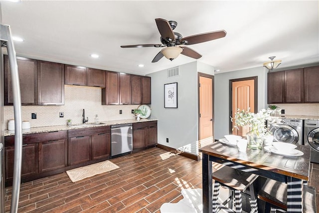 kitchen with dishwasher, independent washer and dryer, dark hardwood / wood-style flooring, sink, and dark brown cabinets