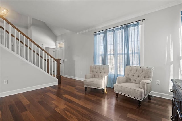 living area with dark hardwood / wood-style flooring and vaulted ceiling