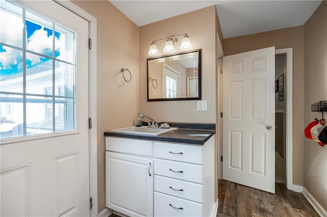 bathroom with vanity and wood-type flooring