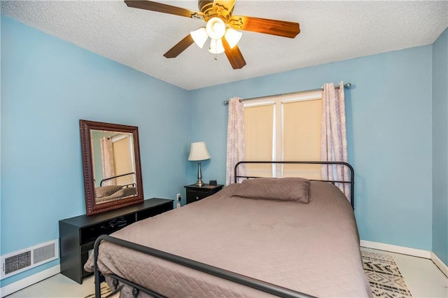 bedroom featuring a textured ceiling and ceiling fan