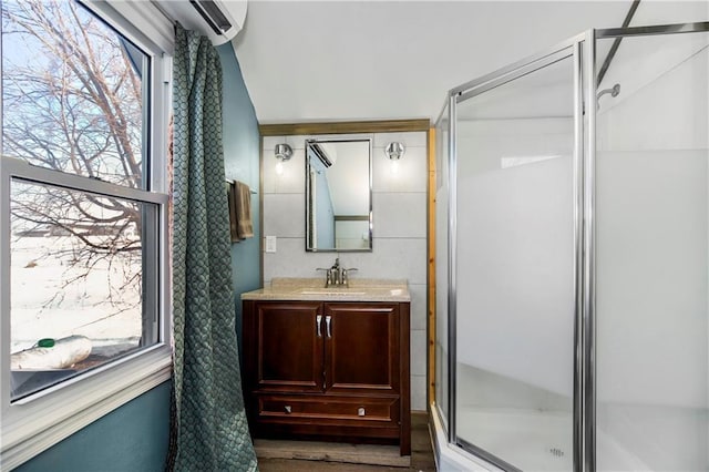 bathroom featuring vanity, hardwood / wood-style floors, and an enclosed shower