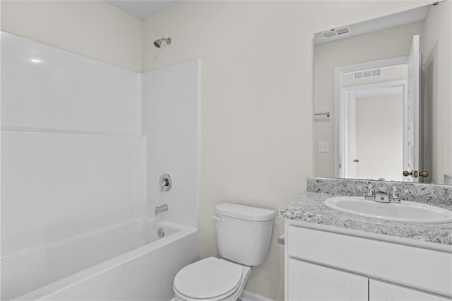 full bathroom with toilet, vanity, and shower / washtub combination