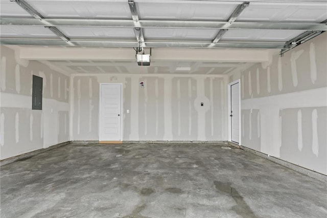 garage featuring a garage door opener and electric panel