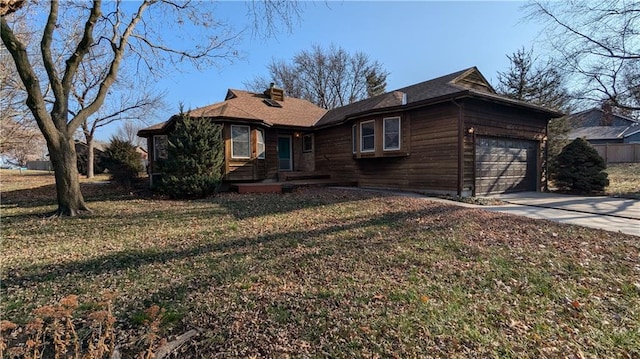 ranch-style house with a front lawn and a garage