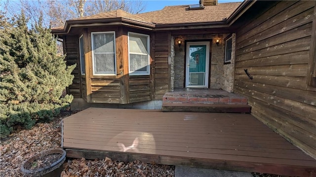 entrance to property with a wooden deck