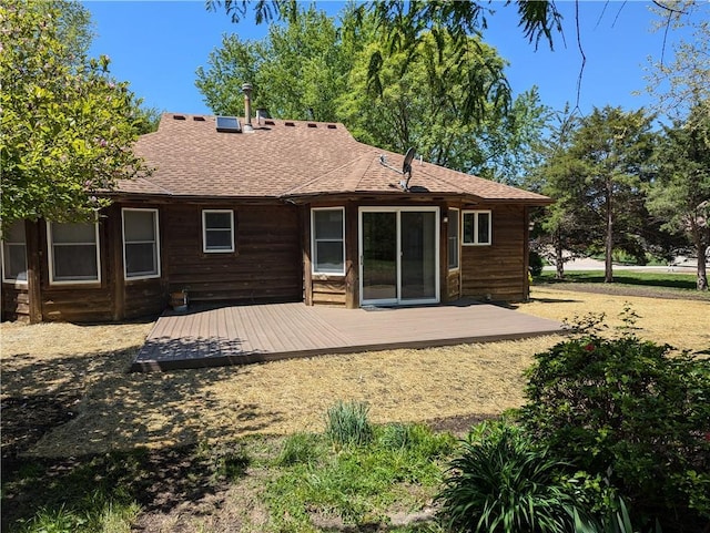 1205 Wentley Dr, Hiawatha, KS 66434 - back of property featuring a wooden deck and roof with shingles