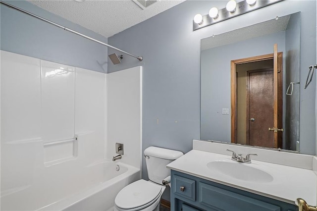 full bathroom featuring toilet, vanity, shower / washtub combination, and a textured ceiling