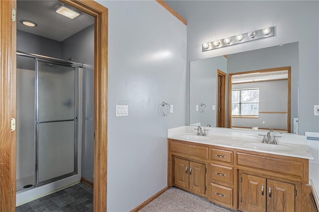 bathroom with vanity and a shower with door