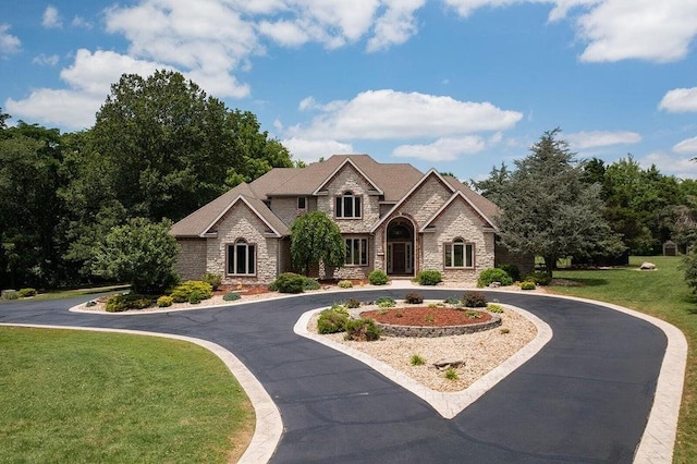 view of front of home with a front lawn