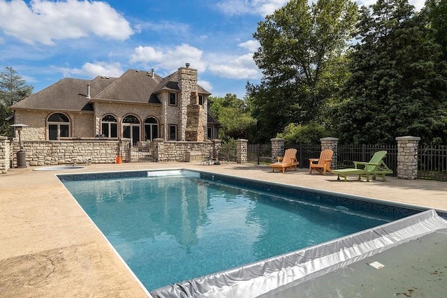 view of swimming pool featuring a patio area