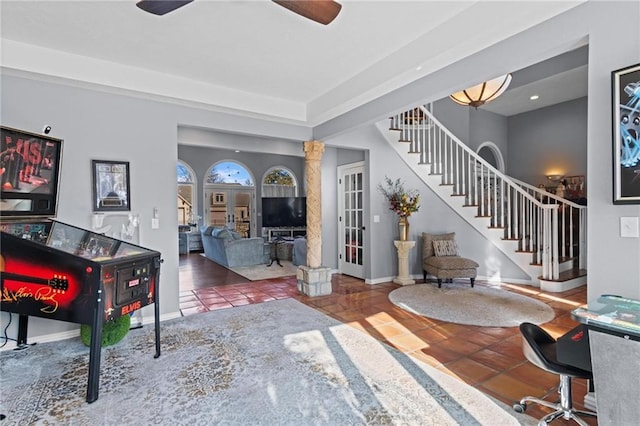 tiled living room with ceiling fan