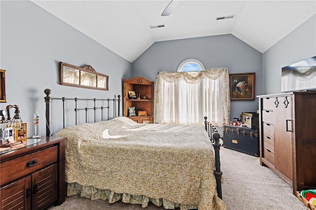 carpeted bedroom with ceiling fan and vaulted ceiling