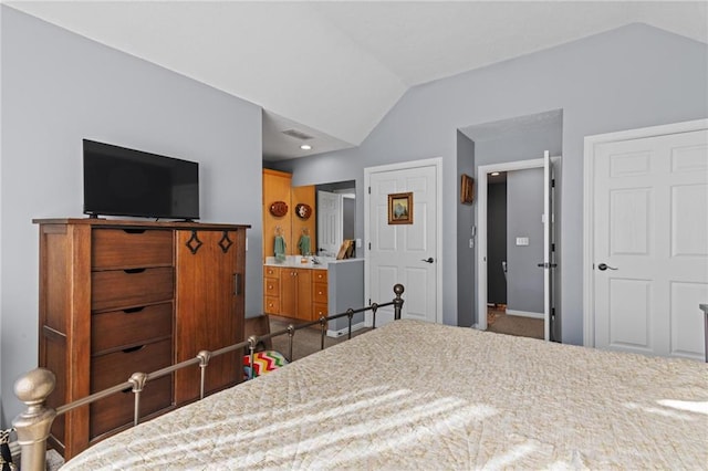 carpeted bedroom featuring vaulted ceiling