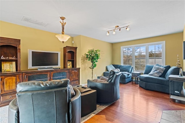 living room with dark hardwood / wood-style flooring