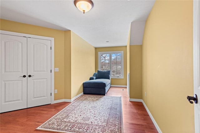 living area with hardwood / wood-style flooring