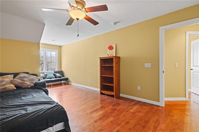 bedroom with ceiling fan and light wood-type flooring