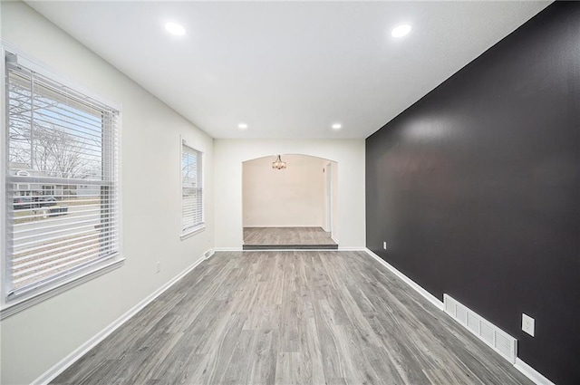 spare room with wood-type flooring