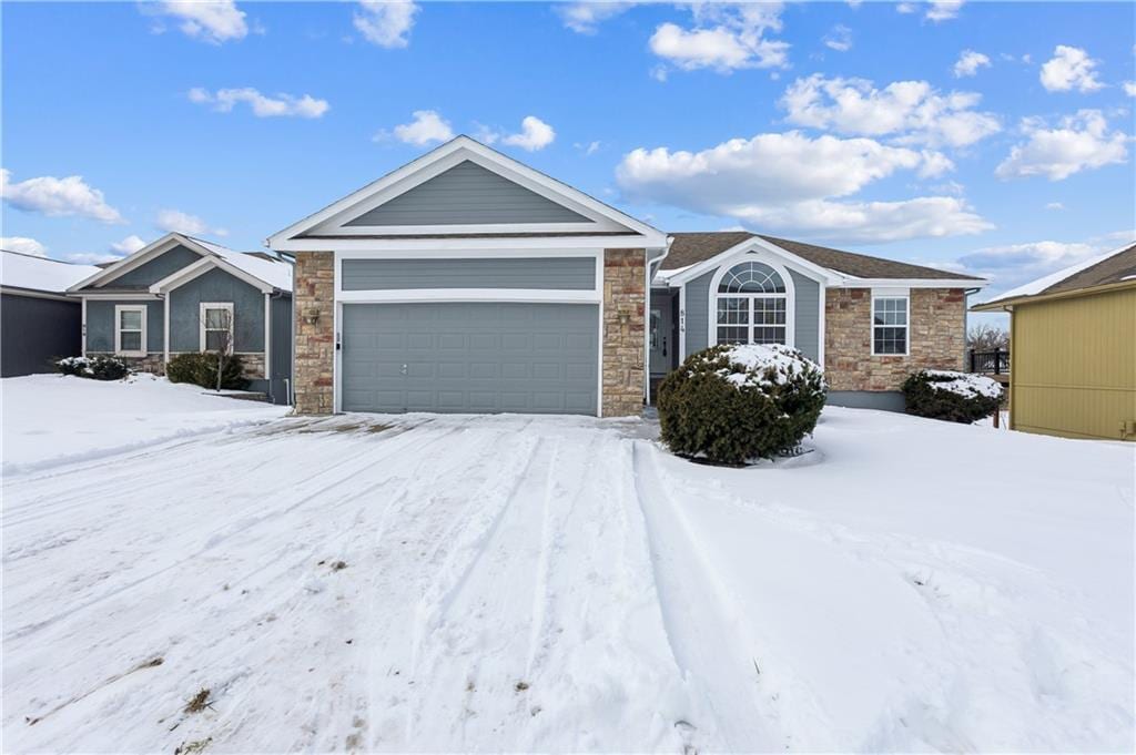 single story home featuring a garage